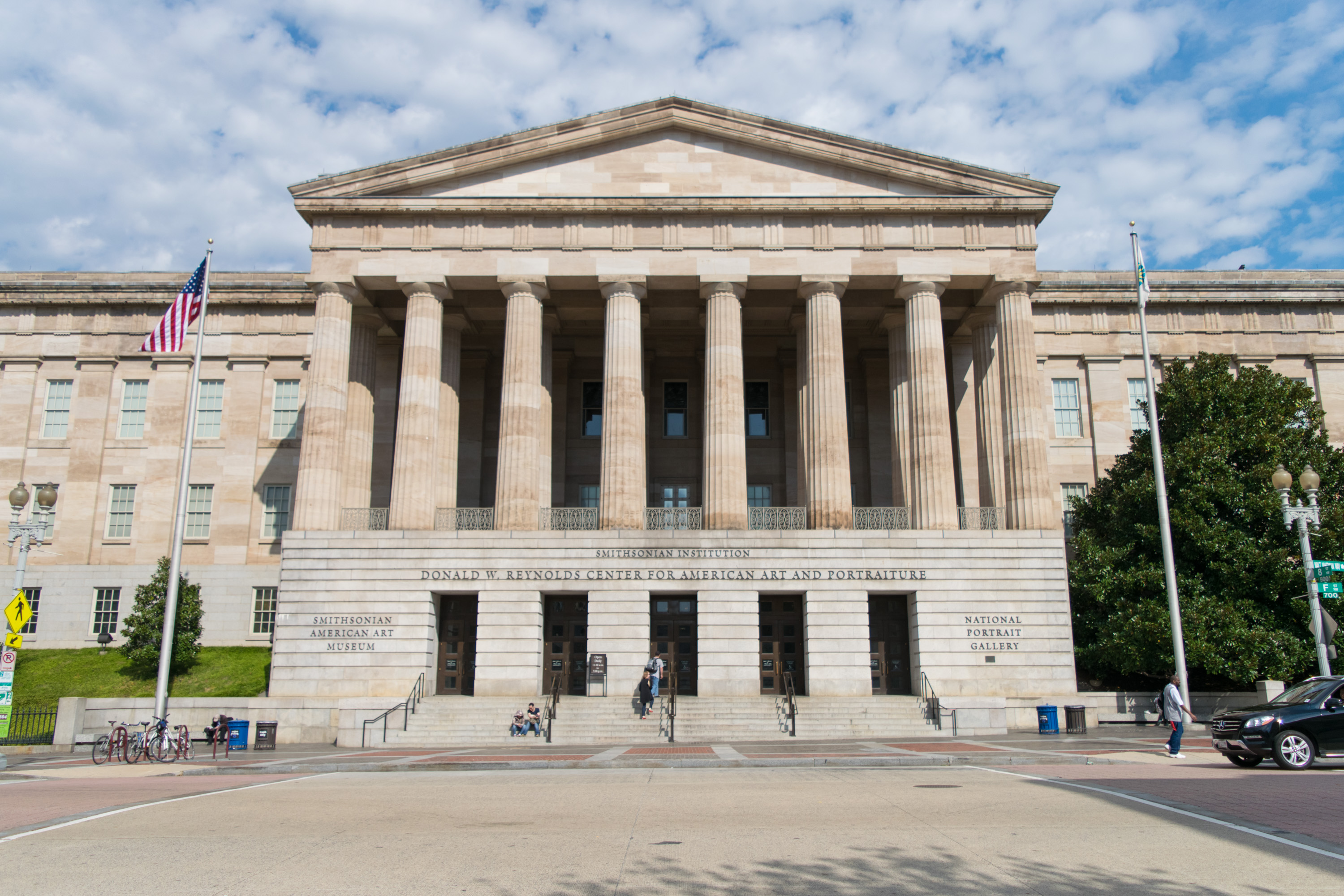 Exterior photo of today's National Portrait Gallery showing its large fluted columns and staircase.